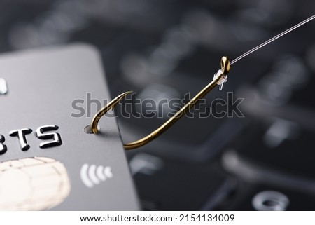 Credit card on fishing hook, phishing scam concept Royalty-Free Stock Photo #2154134009