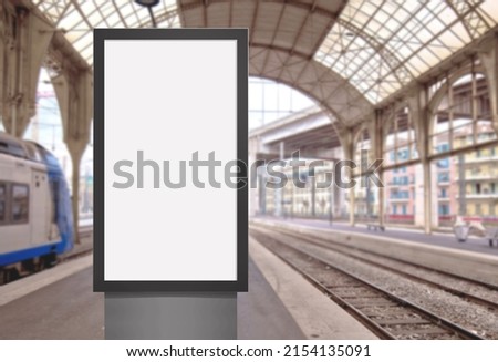 Template of a modern panel with blank white screen for digital media. Signboard mockup for the design of advertisements in railway station.