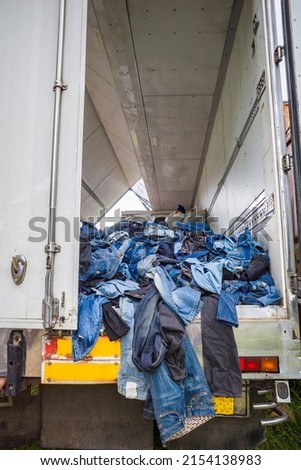 Ella, Sri Lanka Imported second hand jeans from Canada are stacked high in a truck and displayed for bargain sale in a charity scheme.