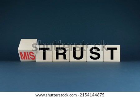 Mistrust or trust. Cubes form the words Mistrust or trust. The concept of trust in business and personal life Royalty-Free Stock Photo #2154144675
