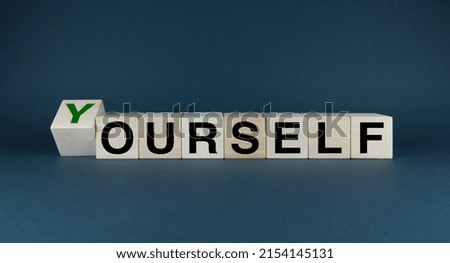 Yourself or ourself. Cubes form the words Yourself or ourself. Business and lifestyle concept