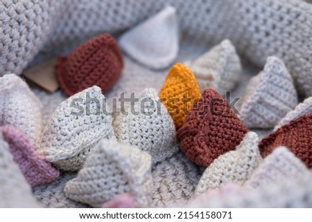 Pip Bags are small triangular crochet bags filled with beans, corn, stones or beads, with which you can play fun games and playfully teach and improve children's motor skills, also as a stress ball Royalty-Free Stock Photo #2154158071