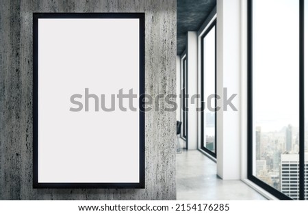 Template of a modern panel with blank white screen in an office corridor. Mockup for the design of advertisements. Royalty-Free Stock Photo #2154176285