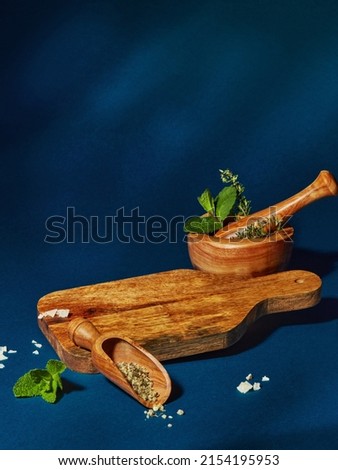 Wooden cutting board and spices