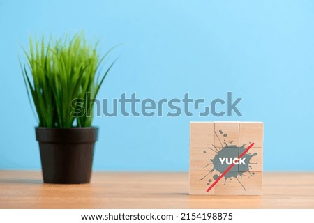 Wooden blocks on blue background with environmental symbol of empty and recycle, no food, no food or liquid food. Ecology concept