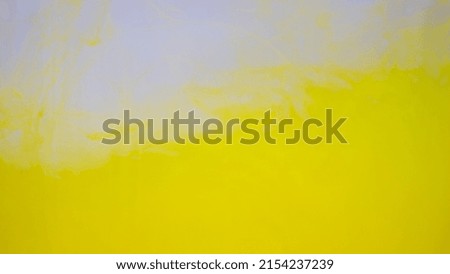 Abstract yellow background photo. Yellow ink splash in the water.