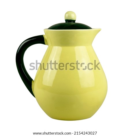 Old yellow ceramic pitcher isolated on white background