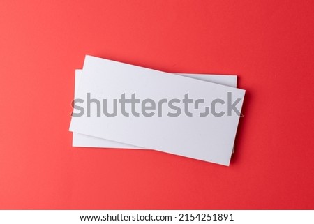 Mockup with corporate business cards on a flat red background