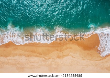 Huge turquoise waves breaking on a lonely sandy beach on Sri Lanka island near Tangalle town Hambantota District. Traveling or exotic Asian countries aerial drone point view concept. Royalty-Free Stock Photo #2154255485