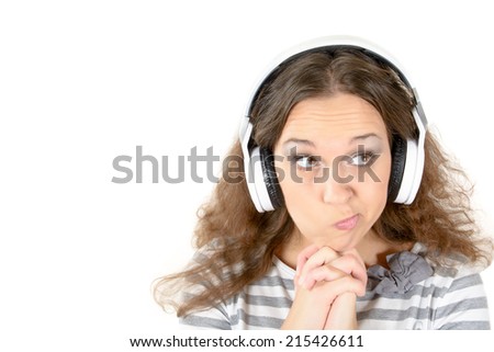 Portrait of female with suspicious expression and headphones,isolated on white background
