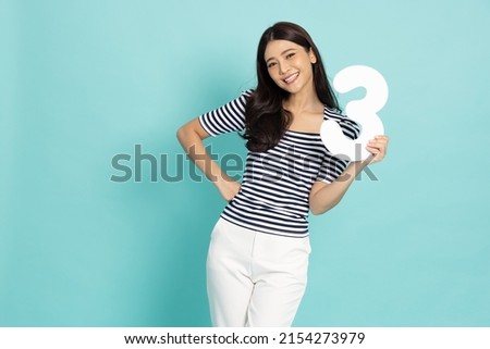 Young Asian woman showing number 3 or three isolated on green background Royalty-Free Stock Photo #2154273979