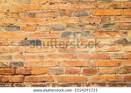 Old brick wall background. Aged brick wall with different brick color