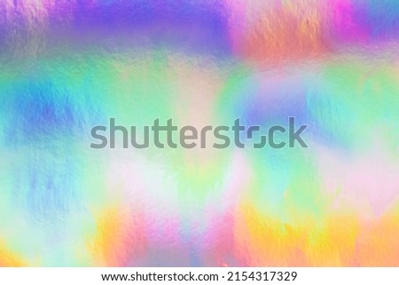 Holographic foil background. Abstract shiny festive backdrop