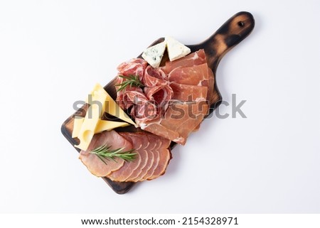 Appetizers table with different antipasti, charcuterie, snacks and cheese. Buffet party. Wooden cutting board isolated on white background, top view
 Royalty-Free Stock Photo #2154328971