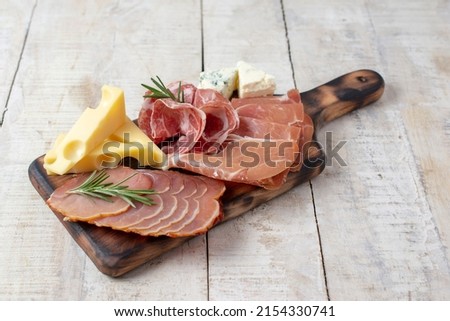 Appetizers table with different antipasti, charcuterie, snacks and cheese. Buffet party. Top view, flat lay, copy space, negative space Royalty-Free Stock Photo #2154330741