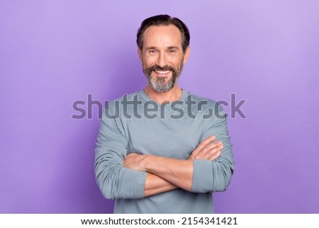 Portrait of cheerful beaming handsome reliable businessman professional worker isolated on purple color background