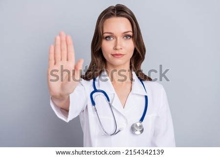 Photo of activist medic lady protest vax want stop covid spread show stop signal palm isolated grey color background Royalty-Free Stock Photo #2154342139