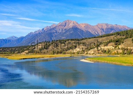 Landscape view of The Steeples in the Canadian Rockies with the Bull River in the East Kootenay near Cranbrook, British Columbia, Canada  Royalty-Free Stock Photo #2154357269
