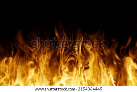 Fire flames on the black background. Fire isolated.