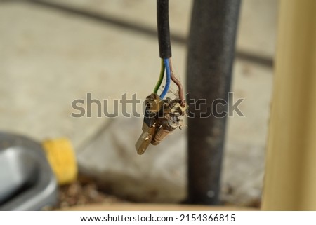 Selective Focus of A Socket Plug Pins, Fuse and Wires. Blurred Background. 