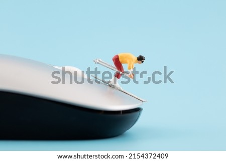 Miniature creative mouse on skis
