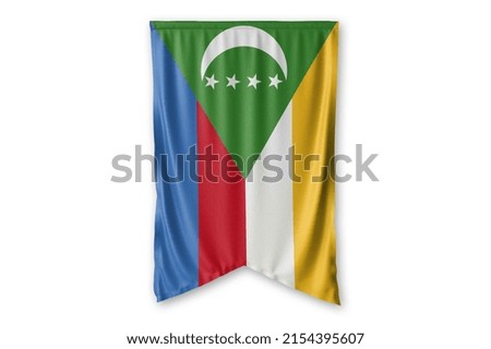 Comoros flag hang on a white wall background. - image.