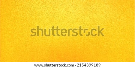 Closeup​ yellow​ wall​ texture​ for​ background. Grunge​ wall​ texture​ for​ vintage​ backgroun​d. Cement​ wall​ pattern for​ background. Concrete​ wall​ texture​ for​ background. Yellow​ texture.