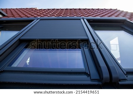 Close up of new skylight with roller shutter Royalty-Free Stock Photo #2154419651
