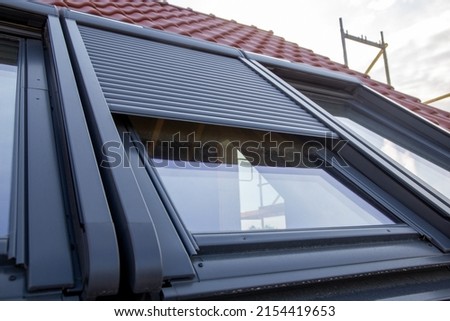 Close up of new skylight with roller shutter Royalty-Free Stock Photo #2154419653