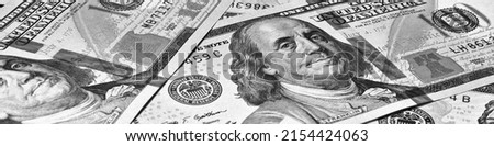 American paper money. 100 dollar and other US bills. Black and white banner or header. Savings economy and the USA dollar. National debt and Treasury Royalty-Free Stock Photo #2154424063