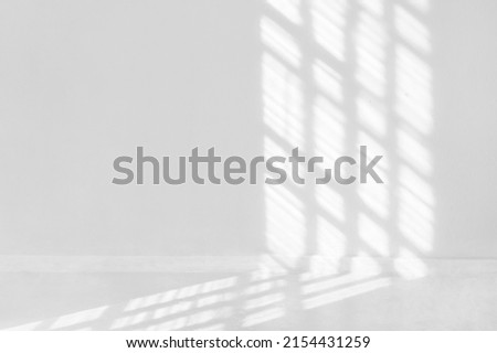 Window shadow overlay on a white wall background. Royalty-Free Stock Photo #2154431259