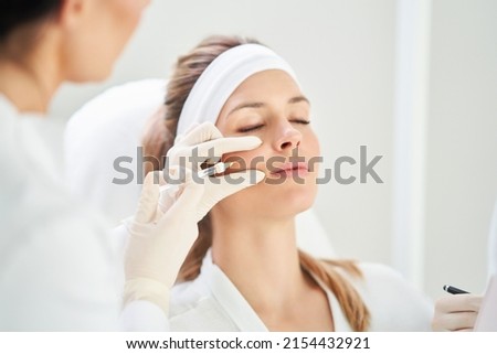 A scene of medical cosmetology treatments botox injection. Royalty-Free Stock Photo #2154432921