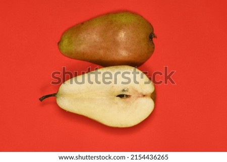 Pears isolated on red background. Pears macro studio photo. High resolution photo. Full depth of field.