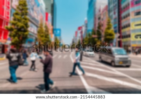 Blur Abstract of Tourists visiting Akihabara or Akiba, well known for selling anime, idol, and manga related goods on sunny day with shop and store open for business Royalty-Free Stock Photo #2154445883
