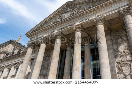 The Reichstag building (Bundestag) in Berlin, Germany, meeting place of the German parliament: The inscription says: Dem Deutschen Volke - To the German people Royalty-Free Stock Photo #2154454099