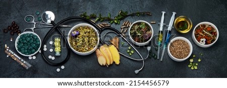 Assortment of herbal and traditional medicine. Traditional healthcare concept. Natural homoeopathic remedies. Top view, flat lay, panorama