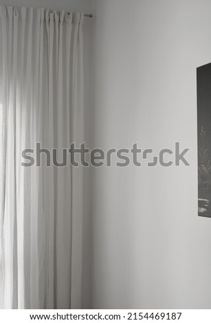 Curtains on a white wall, minimalist interior design, vertical frame.