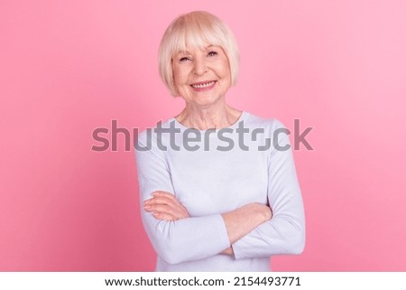 Photo of mature pretty woman crossed hands confident clever marketer isolated over pink color background