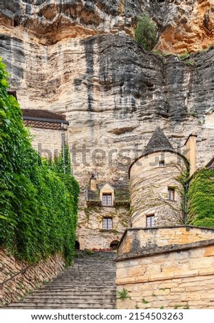 Almost every building in La Roque-Gageac village supports sheer cliff behind. Dordogne department, New Aquitaine region, France