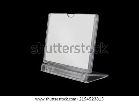 Plastic advertising stand with  room for text isolated on black background.