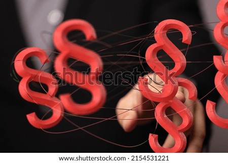 A male's hands pointing to an illustrated law paragraphs - Law and justice concept  3D rendering