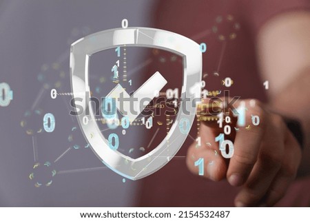 A closeup of illustrated security icon near a hand