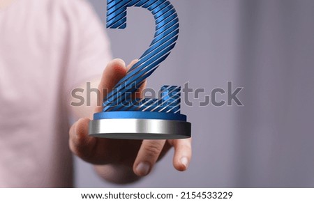 A closeup of illustrated 2 number near a hand