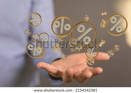A many digital percentages icons on a businessman hand with blurred background