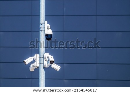 A lot of surveillance cameras are pointing in different directions.