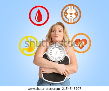 Overweight woman with scales having problems with her health on light blue background Royalty-Free Stock Photo #2154548907