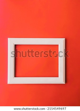 White horizontal art frame on orange background as flatlay design, artwork print or photo album concept