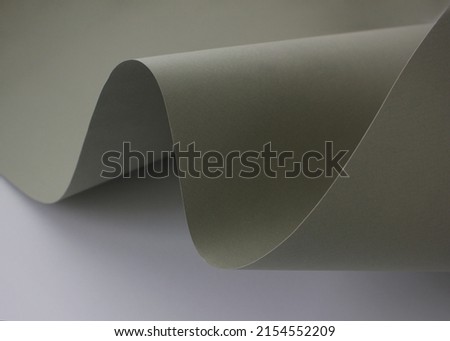 Creative curved wavy green paper. abstract neutral horizontal paper background. Royalty-Free Stock Photo #2154552209