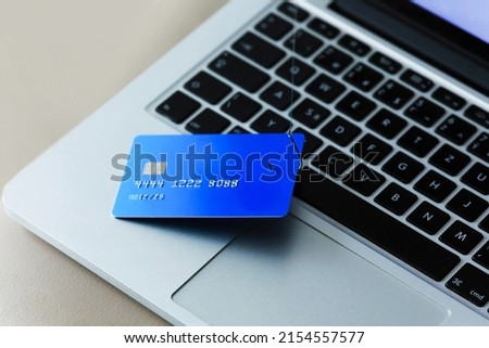 Phishing Credit Cards - Piles of credit cards with fish hook on computer keyboard. Dark cyber attack concept. Background. Royalty-Free Stock Photo #2154557577