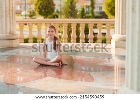 attractive girl doing sports in summer park